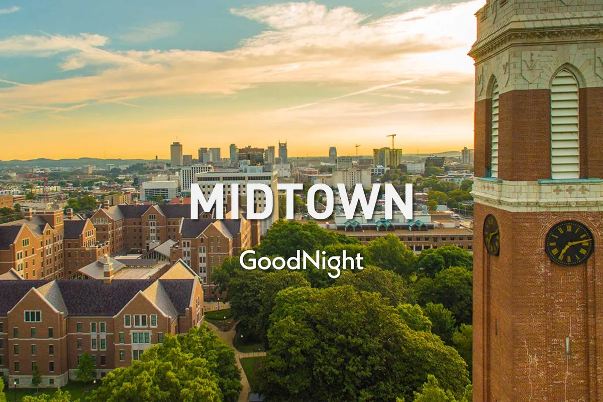 An expansive view of the city skyline, historic buildings, lush trees, and a prominent clock tower create a picturesque setting that hints at nearby cultural landmarks and communal spaces. The scene feels serene and inviting, suggesting opportunities for family outings and exploration.