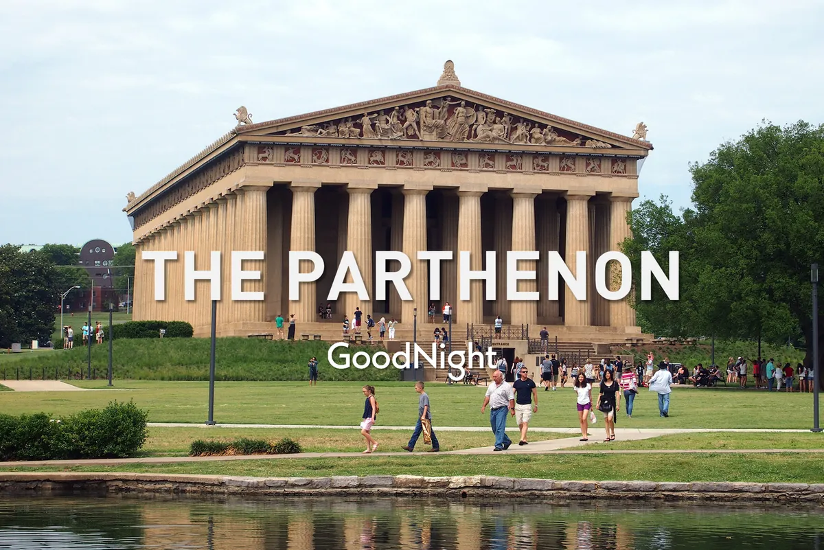 A vibrant exterior shot of The Parthenon, surrounded by lush green lawns and dotted with visitors enjoying sightseeing, photography, and picnicking. The neoclassical architecture stands out as a centerpiece, capturing the essence of Nashville's unique cultural landscape.